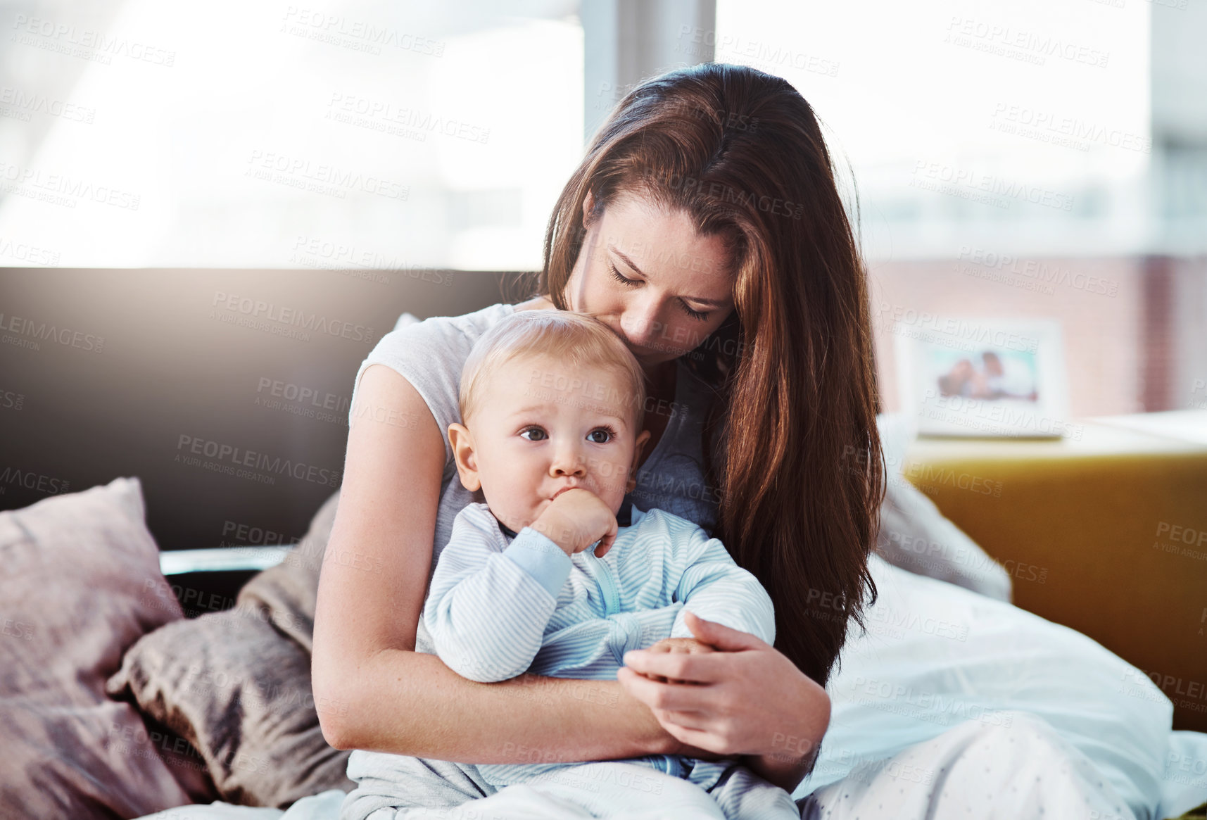 Buy stock photo Baby, mother and hug in bed with love or bedroom, peace in morning and newborn together, relax and calm mom in home. Postpartum, boy and quality time with mama to enjoy, support or care for child