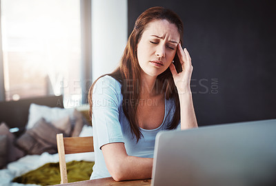 Buy stock photo Stress, remote work and woman with a headache working on a freelance project with a laptop. Burnout, sick and female freelancer with a migraine in pain doing research at her desk or workspace at home