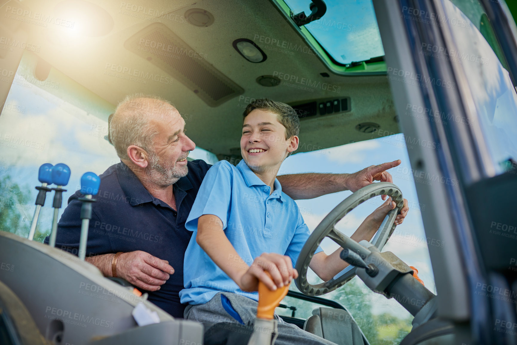 Buy stock photo Agriculture, father and son on tractor for teaching, love and bonding together with happiness. Family, dad and boy on farming vehicle for drive, learning and child development with smile on break