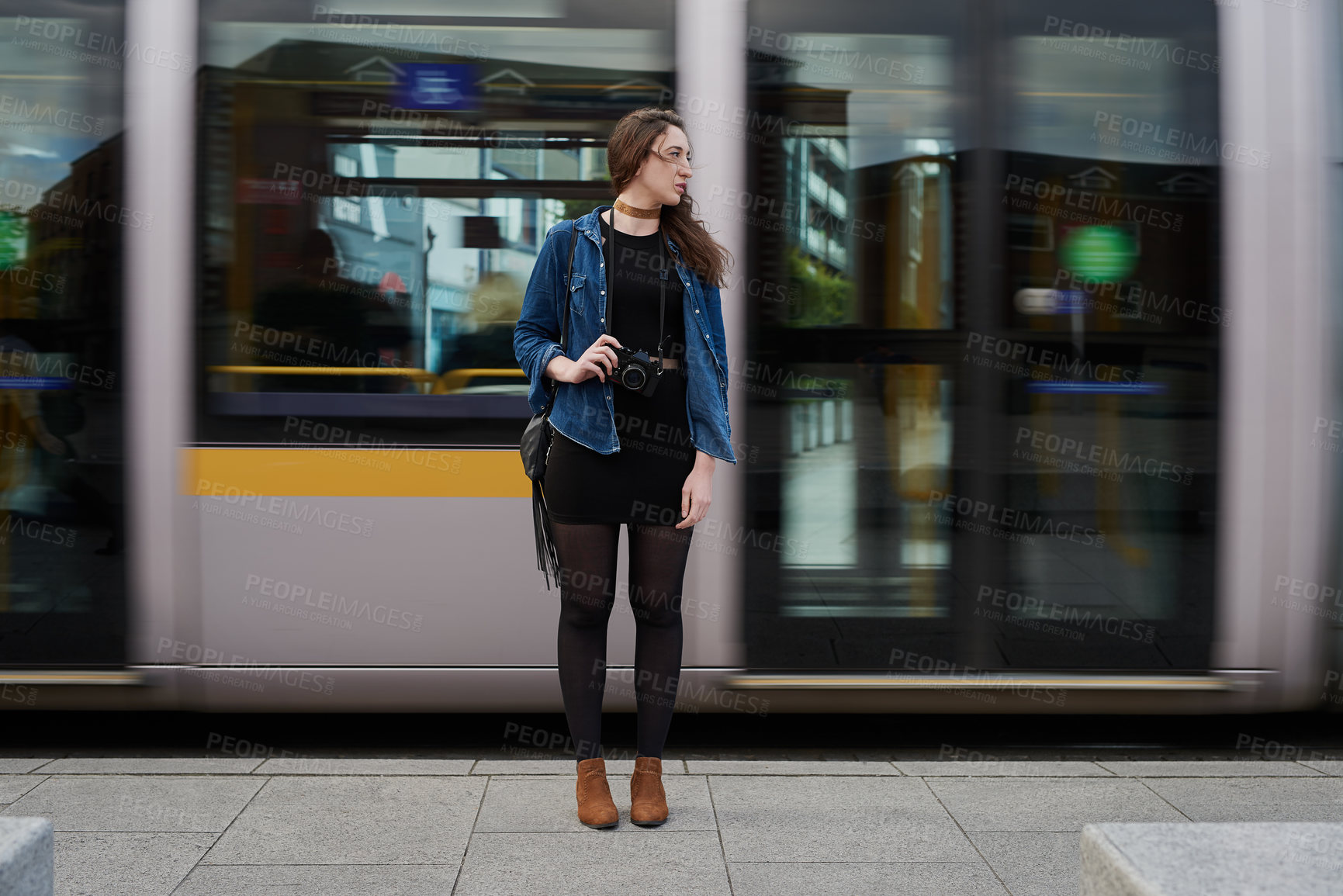 Buy stock photo Photographer, woman and travel by train with camera in city for memory, vacation or tourism. Photography, subway and girl in urban street for public transport, holiday and thinking of journey outdoor