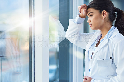 Buy stock photo Stress, thinking and doctor woman by window with worry, anxiety and tired with headache in clinic. Healthcare, mental health and sad female health worker stressed, depressed and burnout in hospital