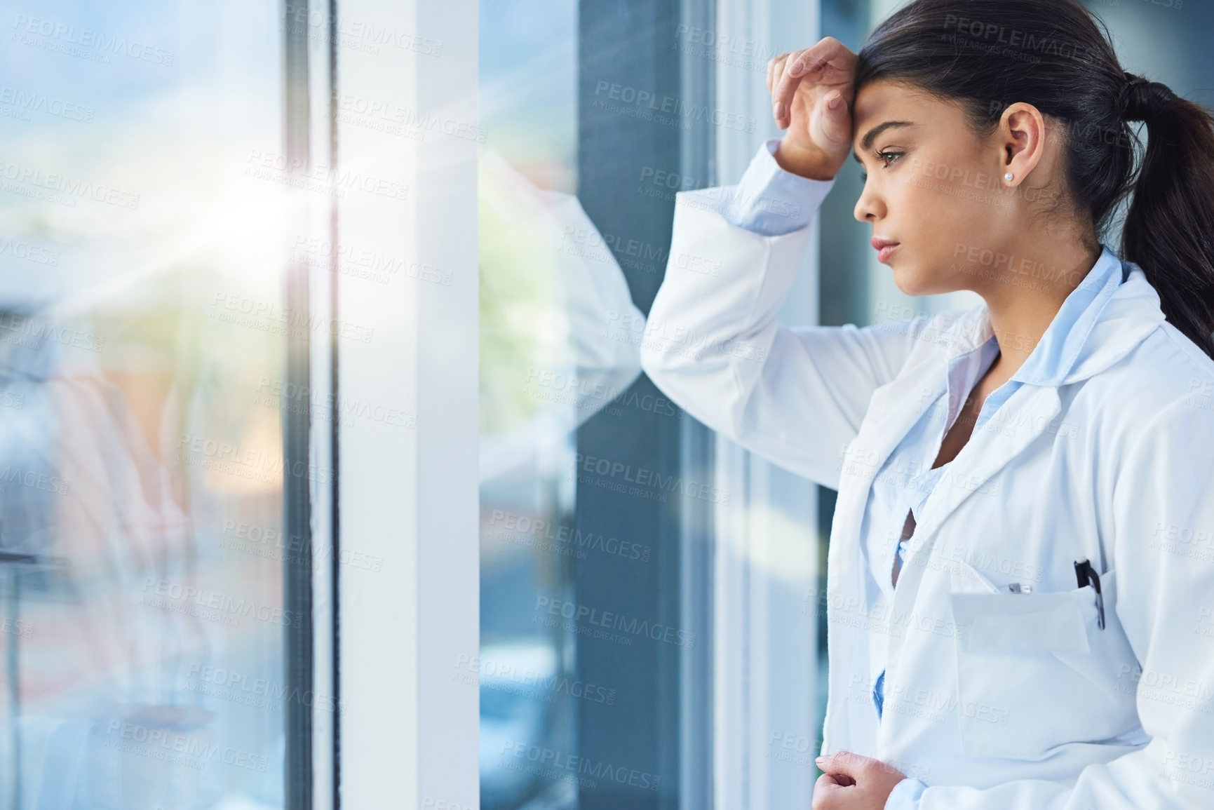 Buy stock photo Stress, thinking and doctor woman by window with worry, anxiety and tired with headache in clinic. Healthcare, mental health and sad female health worker stressed, depressed and burnout in hospital