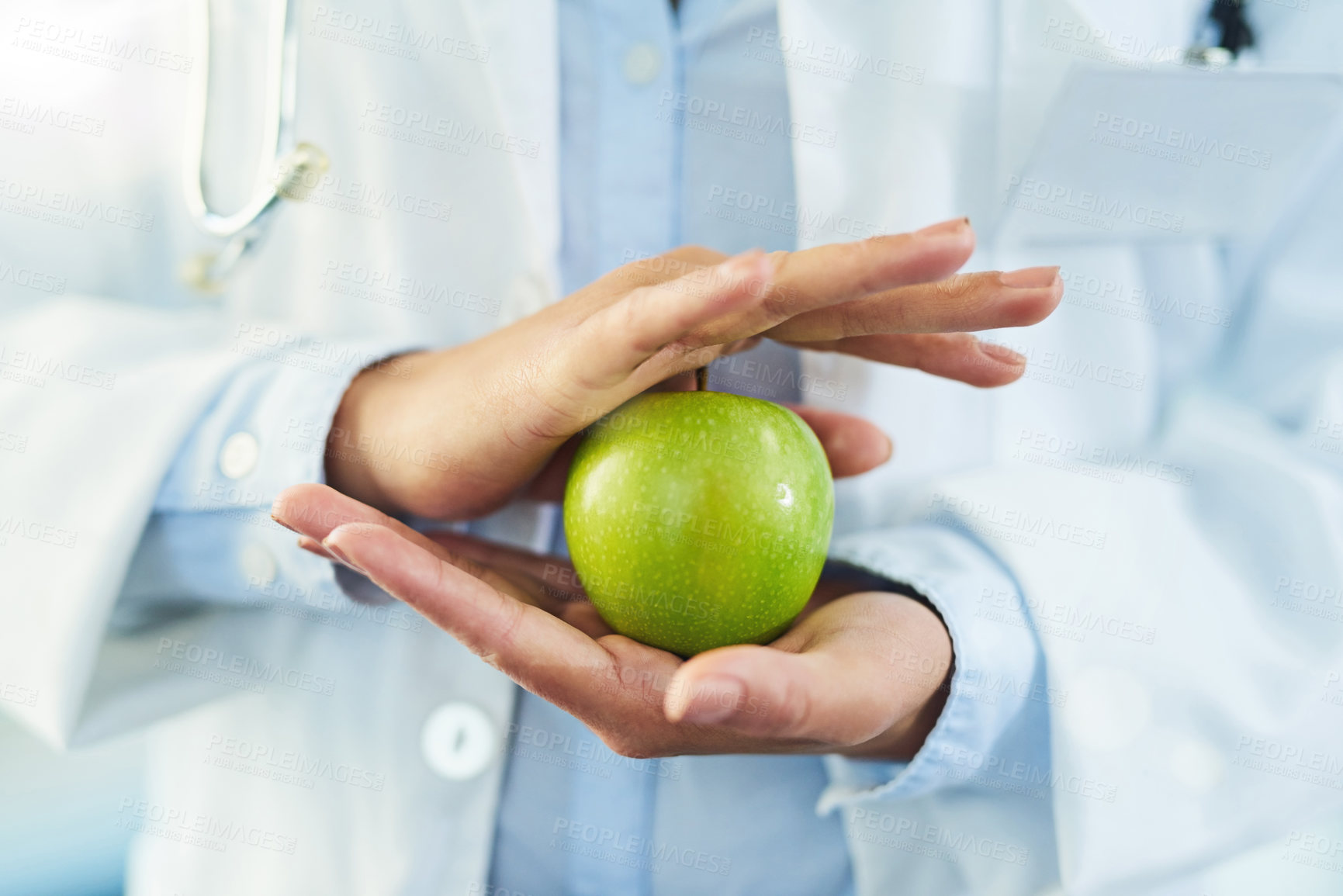 Buy stock photo Hands, doctor and nutritionist with apple for nutrition, healthy diet and wellness. Medical professional, hand and woman with fruit for vitamin c, healthcare or natural food for vegan health benefits