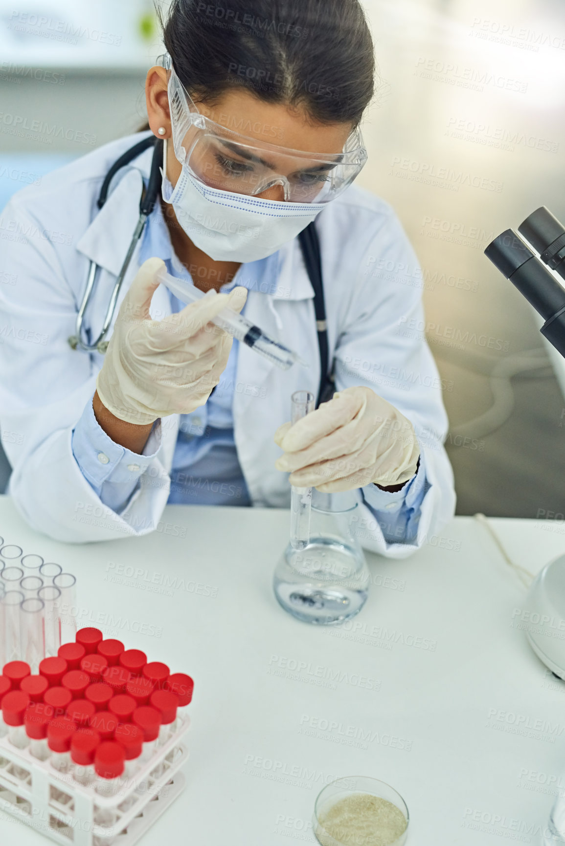 Buy stock photo Woman, science and beaker with syringe at lab, assessment and liquid drug in test tube. Person, chemistry and safety glasses with monkey pox research, medicine and above for vaccine at pharma job