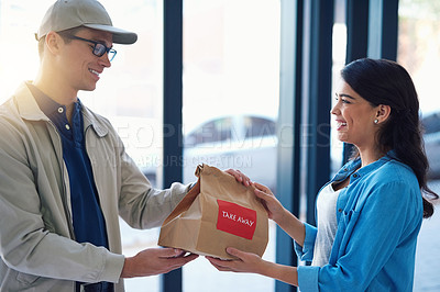 Buy stock photo Shot of a man making a takeaway delivery to a woman