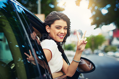 Buy stock photo Shot of an attractive young woman celebrating her new car