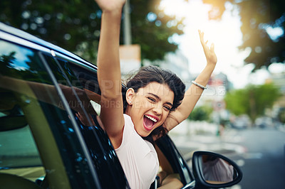 Buy stock photo Shot of an attractive young woman celebrating her new car