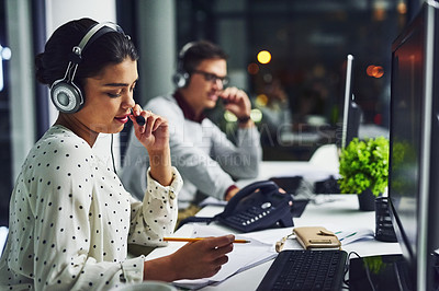 Buy stock photo Call center, customer service and a woman at night, working in the office for consulting or assistance. CRM, contact us and support with a female consultant using a headset to help a client online