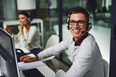 Buy stock photo Portrait of young call centre agents working late in an office