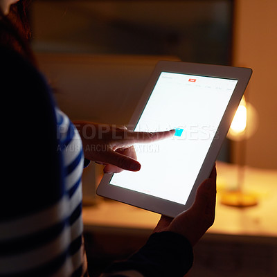Buy stock photo Closeup shot of an unidentifiable businesswoman working late on a digital tablet in an office