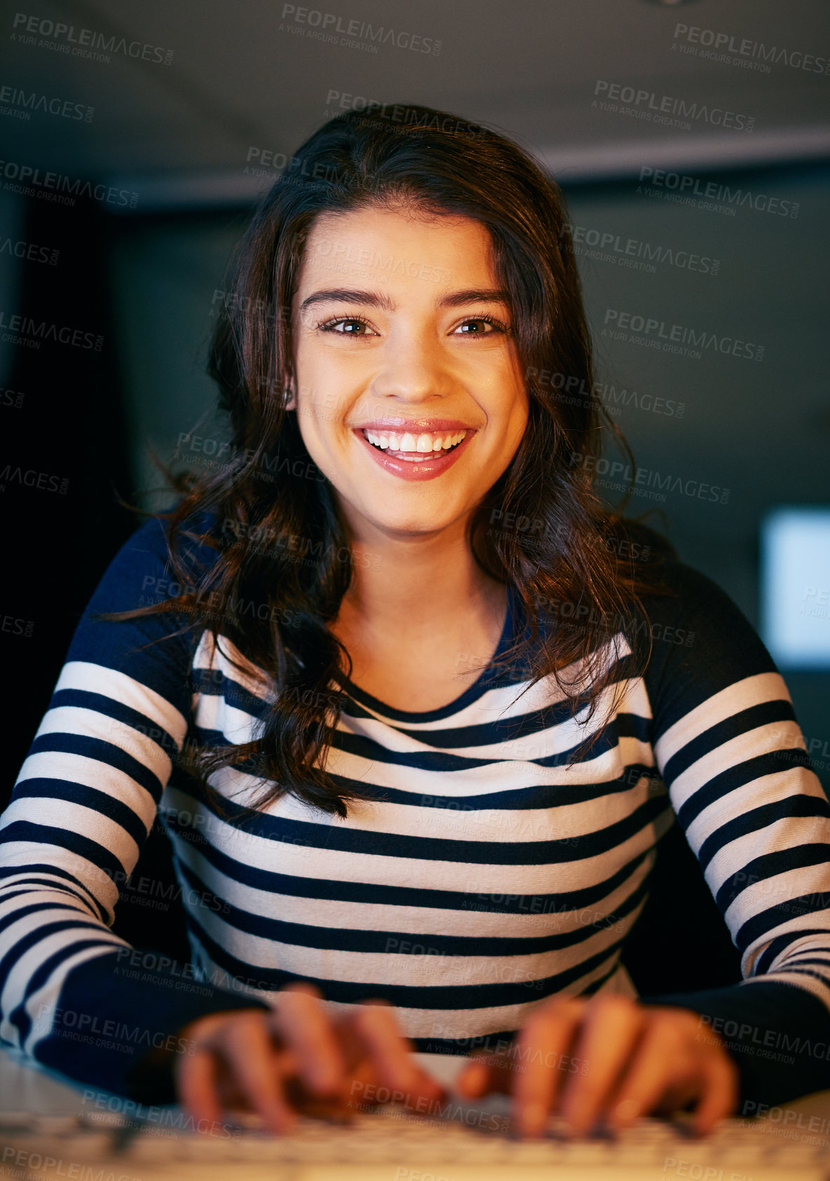 Buy stock photo Portrait of a young businesswoman working late in an office