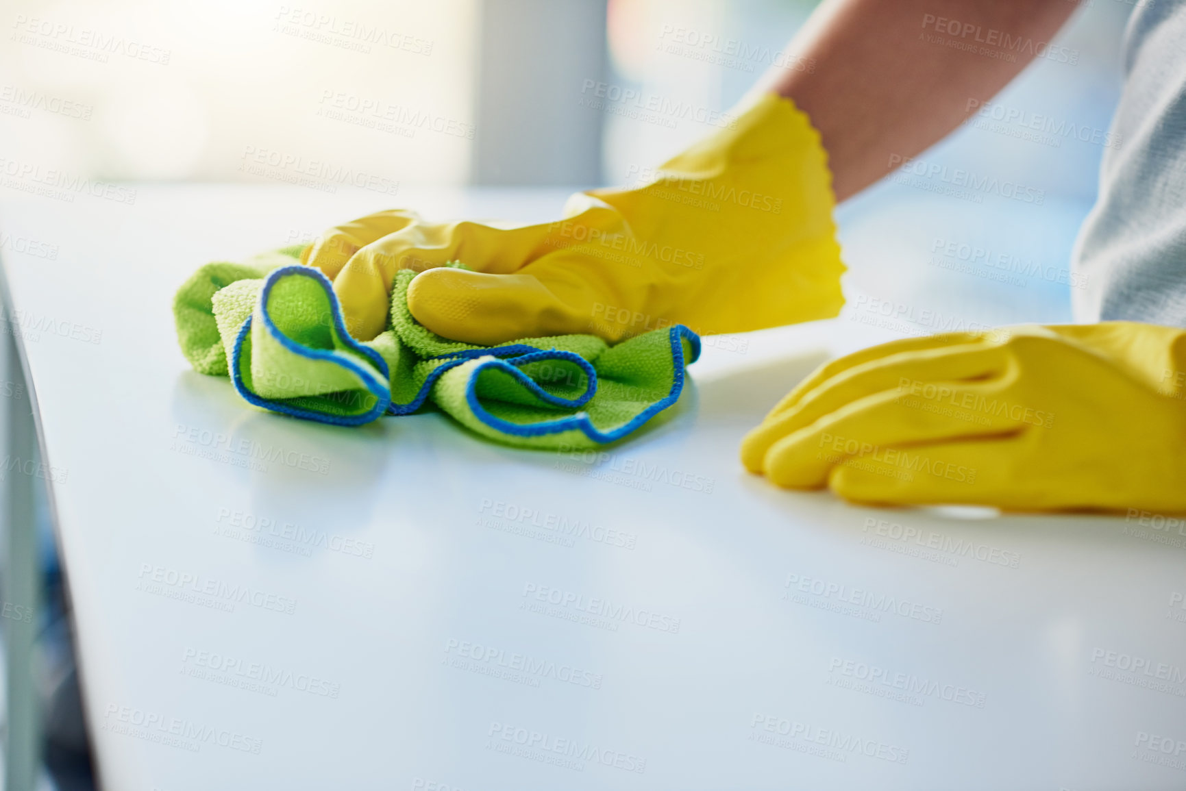 Buy stock photo Shot of an unrecognizable woman doing her daily chores at home