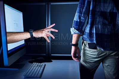 Buy stock photo Cropped shot of an unrecognizable male hacker's hand reaching out from a computer screen