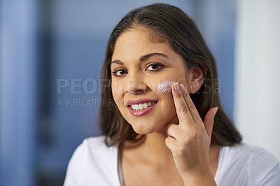 Buy stock photo Shot of an attractive young woman getting ready in her bathroom