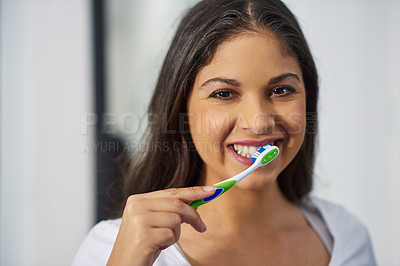 Buy stock photo Shot of an attractive young woman getting ready in her bathroom