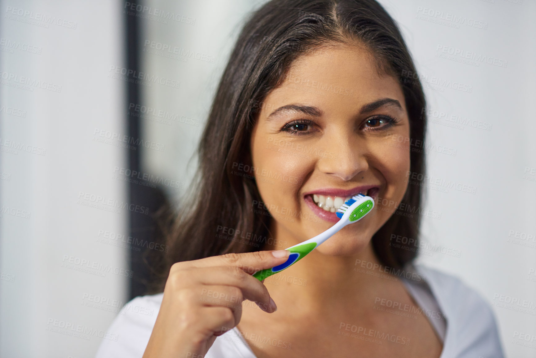 Buy stock photo Shot of an attractive young woman getting ready in her bathroom