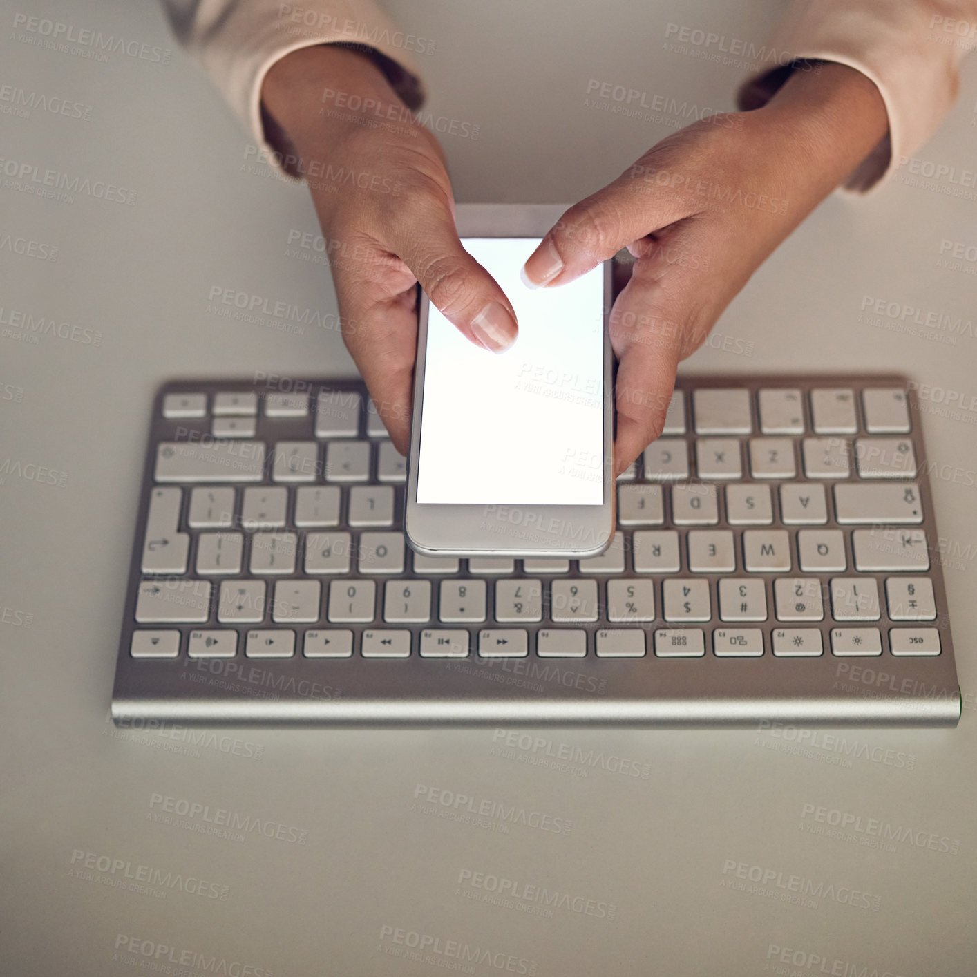 Buy stock photo High angle shot of an unrecognizable businesswoman using a mobile phone