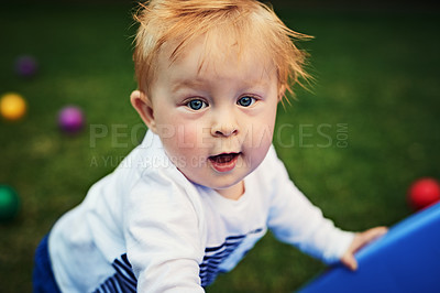 Buy stock photo Outdoor, fun and portrait of cute baby, playground and wellness with games, relax and young in park. Nature, growth and development for child, playing and learning of toddler and lawn of Ireland