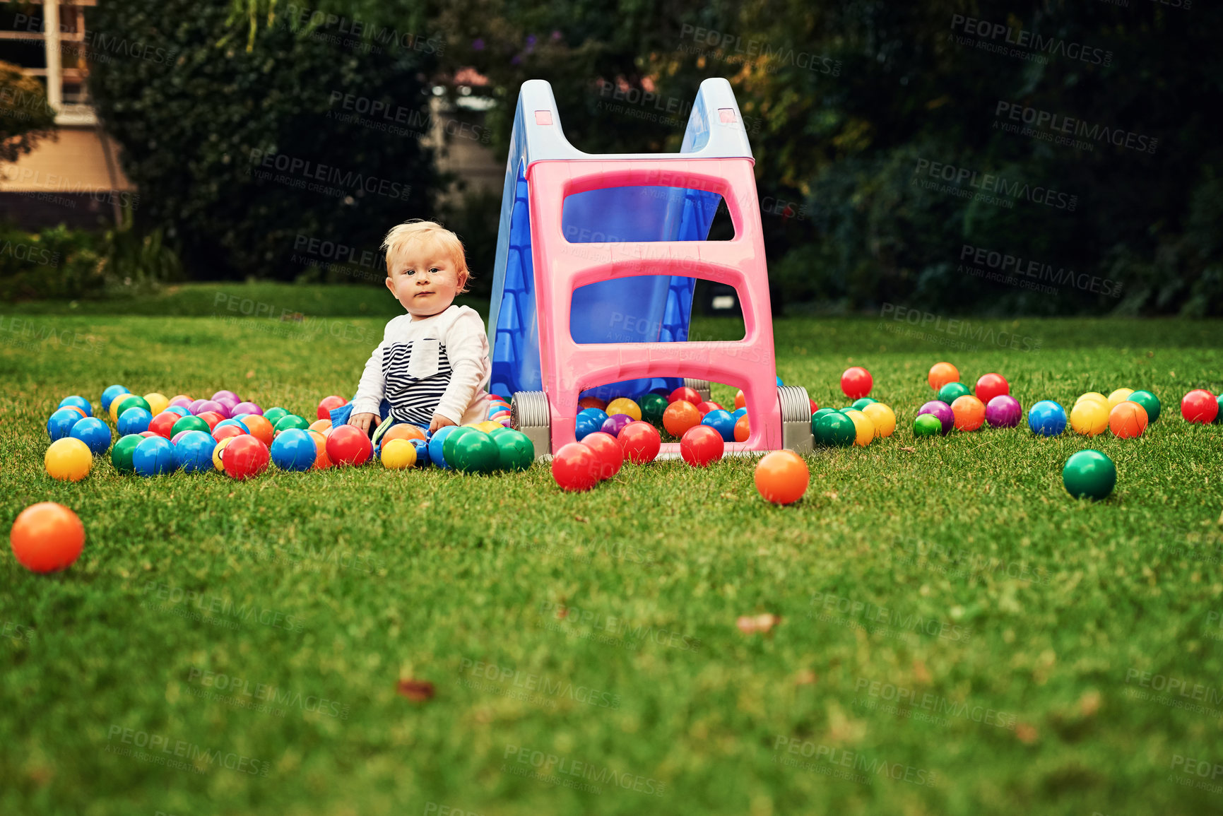 Buy stock photo Outdoor, ball and portrait of cute baby, playground and wellness with games, relax and young in space. Nature, growth and development for child, playing and learning of toddler and lawn of Ireland