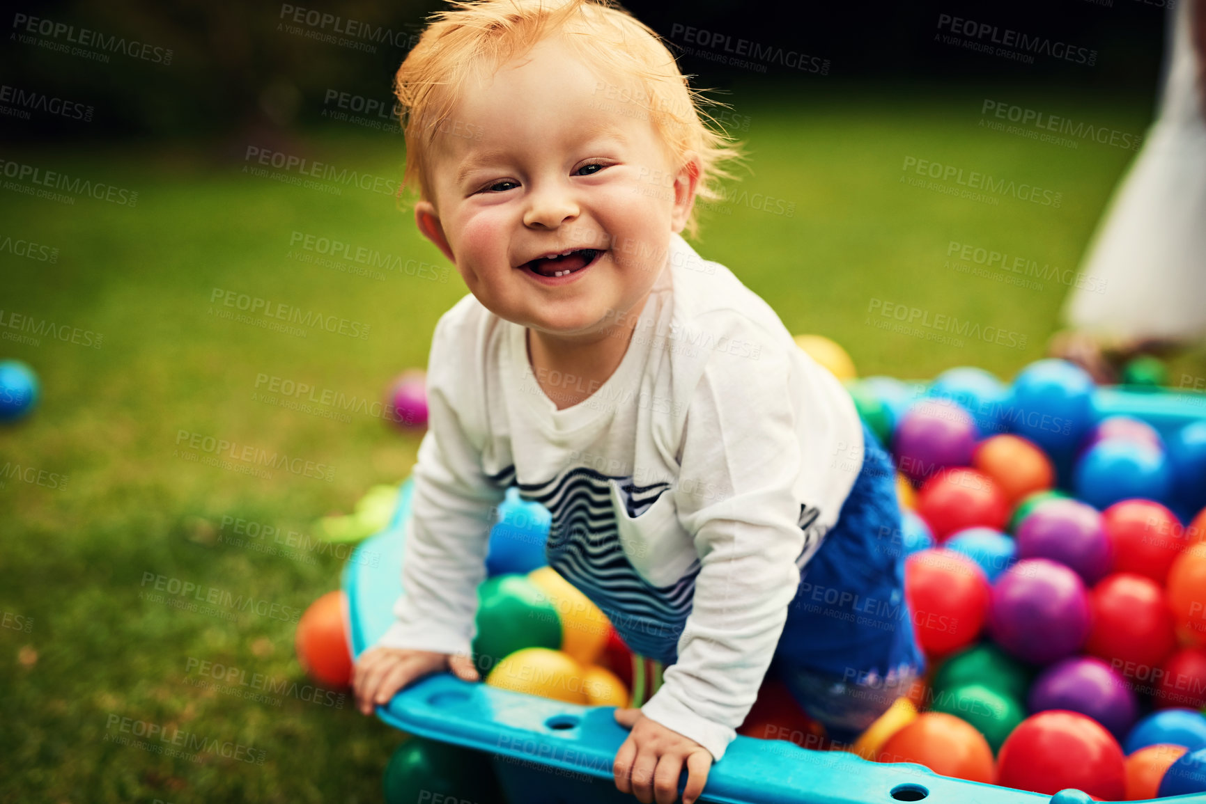 Buy stock photo Shot of an adorable little boy playing in the backyard