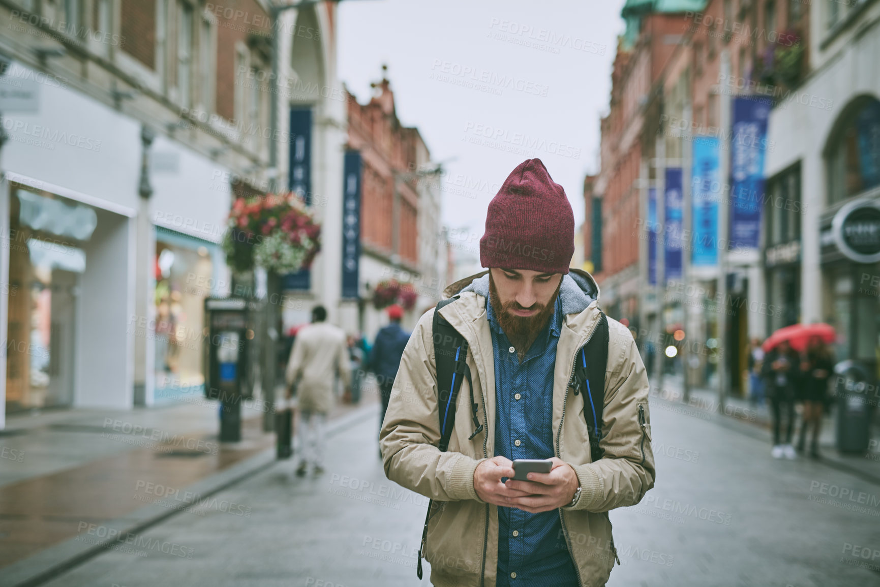 Buy stock photo Walking, street and phone of man with search, direction and travel in London on vacation. Location app, tourist and journey with navigation, text and digital guide for holiday in city with mobile