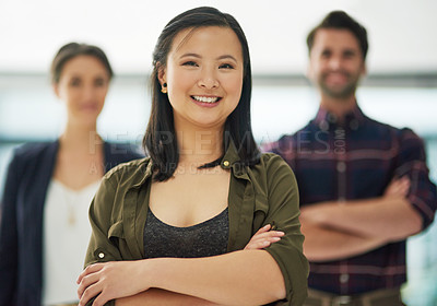 Buy stock photo Portrait, leader and confident business woman in office with team in startup company. Face, arms crossed and smile of professional entrepreneur, designer or employee coworking with creative group