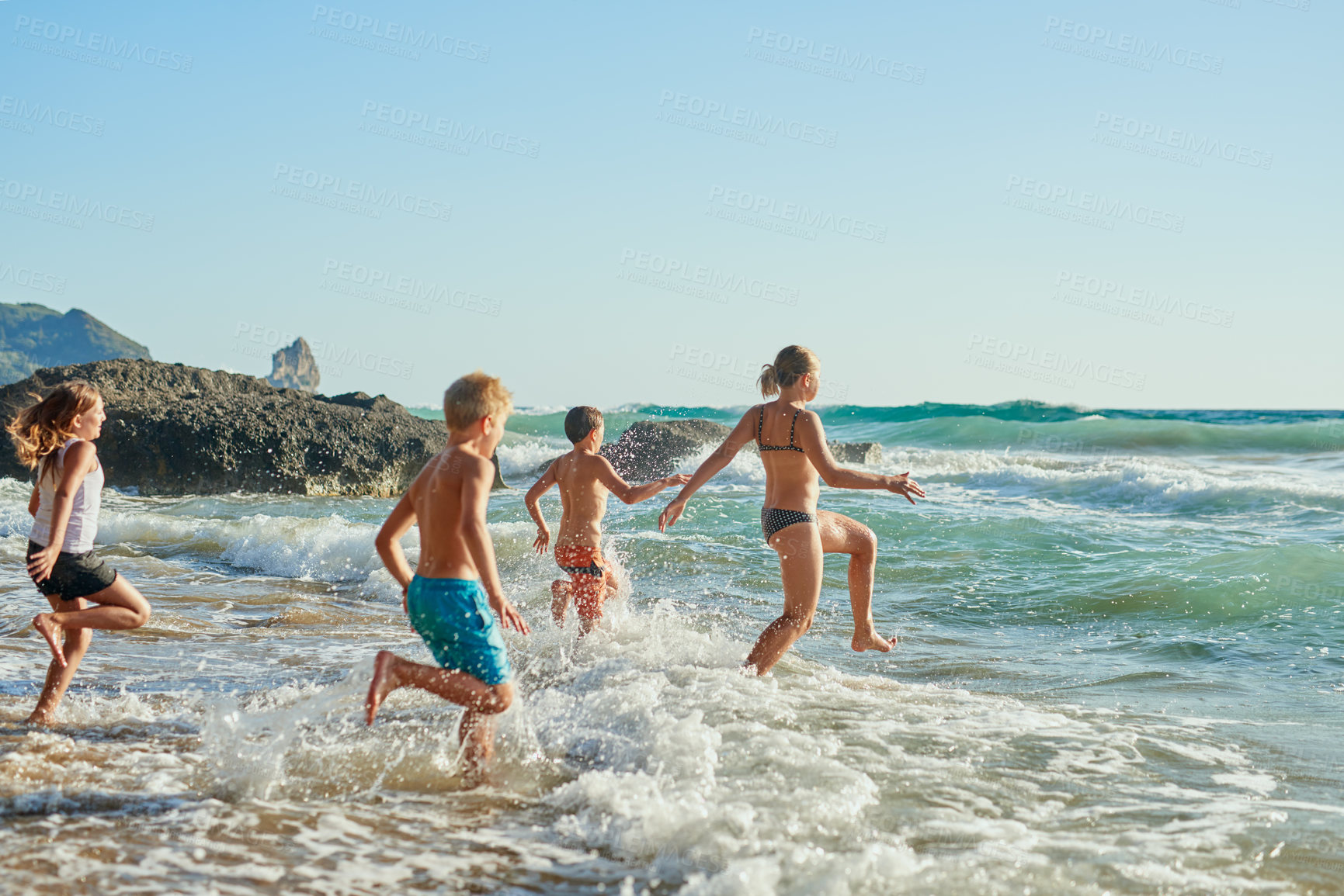 Buy stock photo Children, running and outdoor fun on beach, travel and holiday trip to ocean for childhood. Kids, siblings and playing for freedom in water nature, bonding adventure and vacation on tropical island