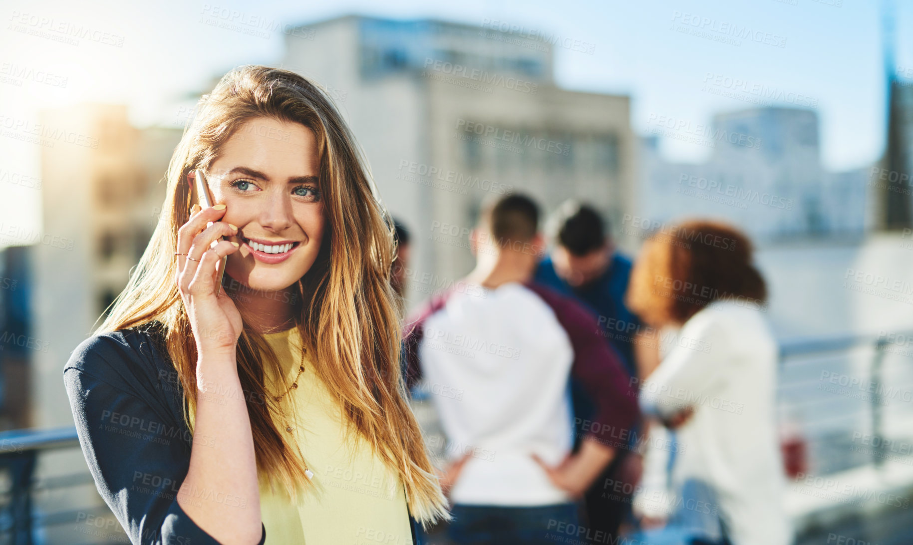 Buy stock photo Cropped shot of an attractive young woman making a phone call while standing outside
