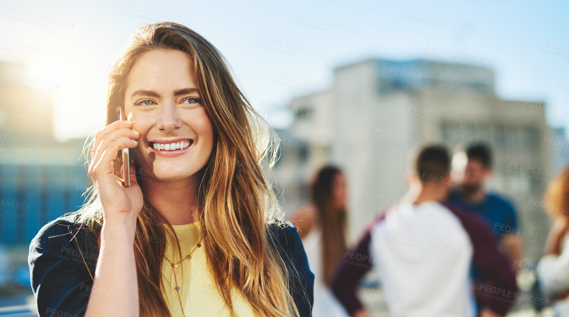 Buy stock photo Cropped shot of an attractive young woman making a phone call while standing outside