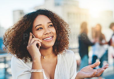 Buy stock photo Cropped shot of an attractive young woman making a phone call while standing outside