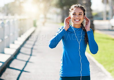 Buy stock photo Girl, runner and smile with earphones, outdoor and audio with memory, workout and excited in summer. Woman, happy and listening to music with streaming for training, exercise and fitness in Colombia