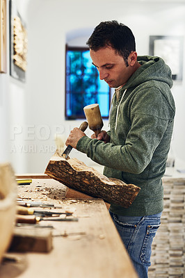 Buy stock photo Cropped shot of an artist carving something out of wood