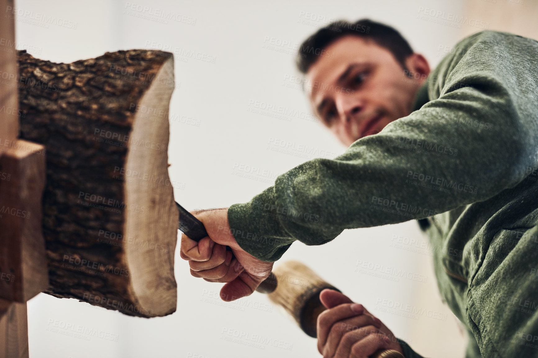 Buy stock photo Cropped shot of an artist carving something out of wood