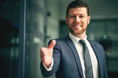 Buy stock photo Portrait of a businessman extending a handshake in an office