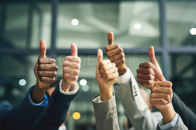 Buy stock photo Closeup shot of a group of unidentifiable businesspeople showing thumbs up in an office