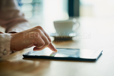 Buy stock photo Closeup of business hands working on a digital tablet in a modern office. Professional at work on touch screen browsing the online market for data or information on trading, investment or growth.