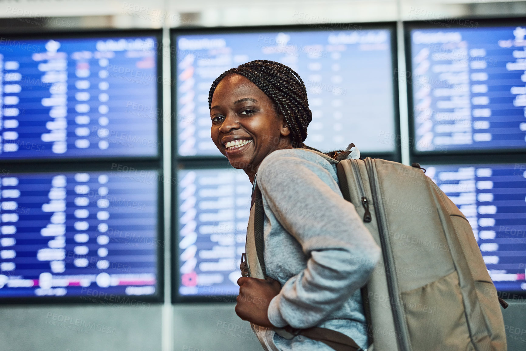 Buy stock photo Portrait, black woman and backpack for travel at airport with board, flight information and transport service. Smile, girl and luggage for international, vacation opportunity and journey at terminal