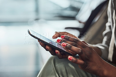 Buy stock photo Cropped shot of an unrecognizable woman using her digital tablet