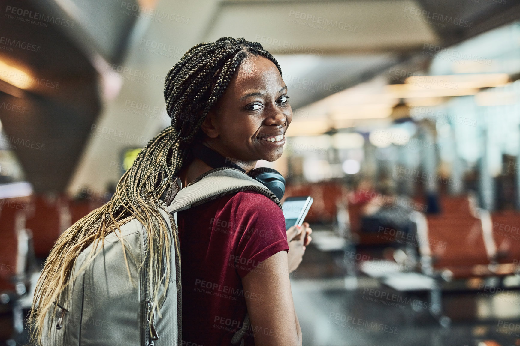 Buy stock photo Airport, portrait and smile of black woman with smartphone, connection and mobile app for flight time. Happy person, traveler and backpack with pride for travel, destination or walking with cellphone