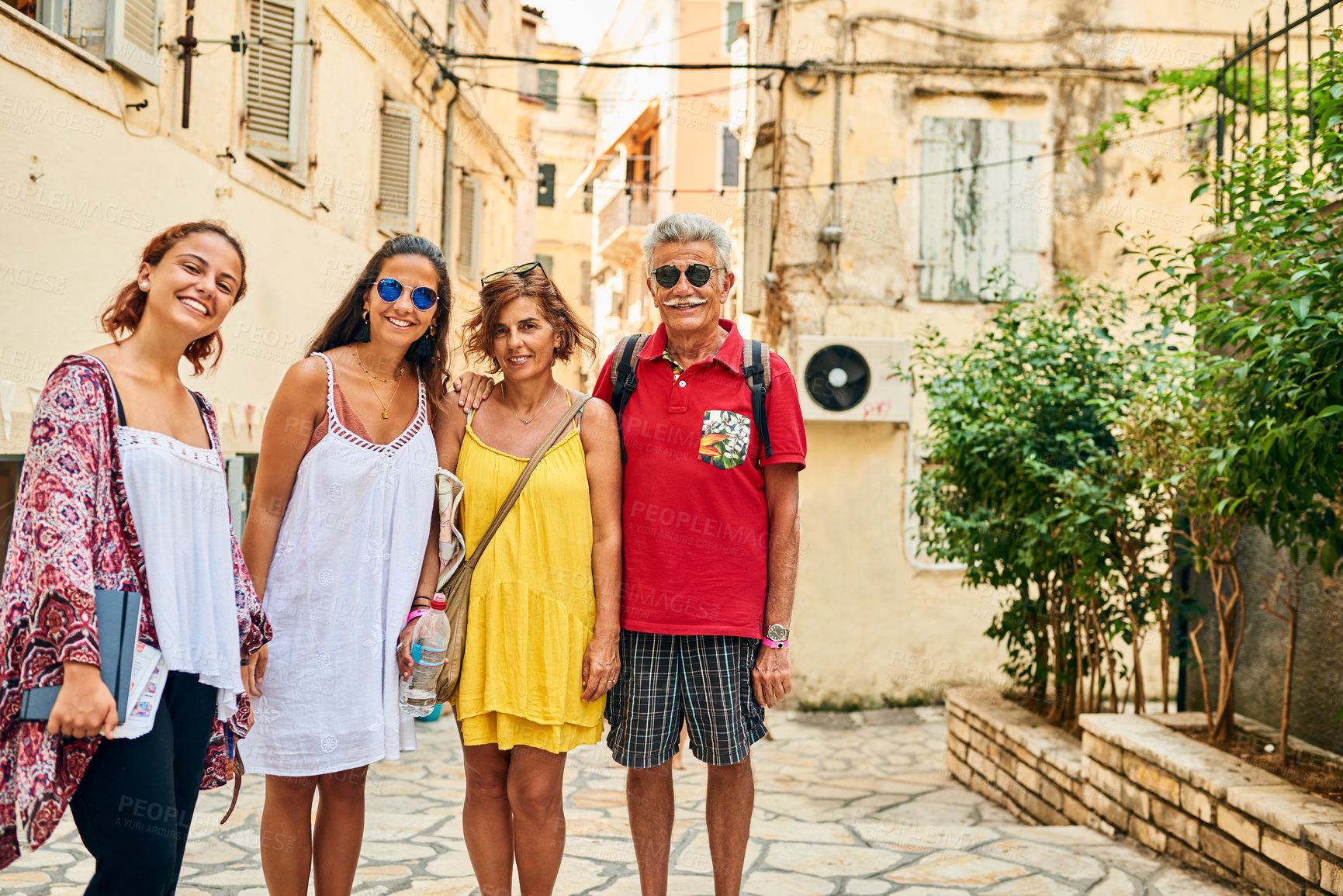 Buy stock photo Cropped portrait of a family of four travelling in a foreign city