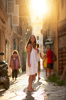 Buy stock photo Portrait, smile and woman travel in city for vacation, holiday and outdoor for shopping in Spain. Happy girl, tourist and adventure in urban street for journey, summer and walk with family at sunset