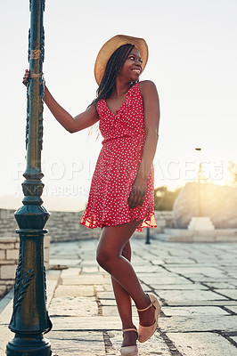 Buy stock photo Shot of a beautiful young woman spending her day out exploring a foreign city