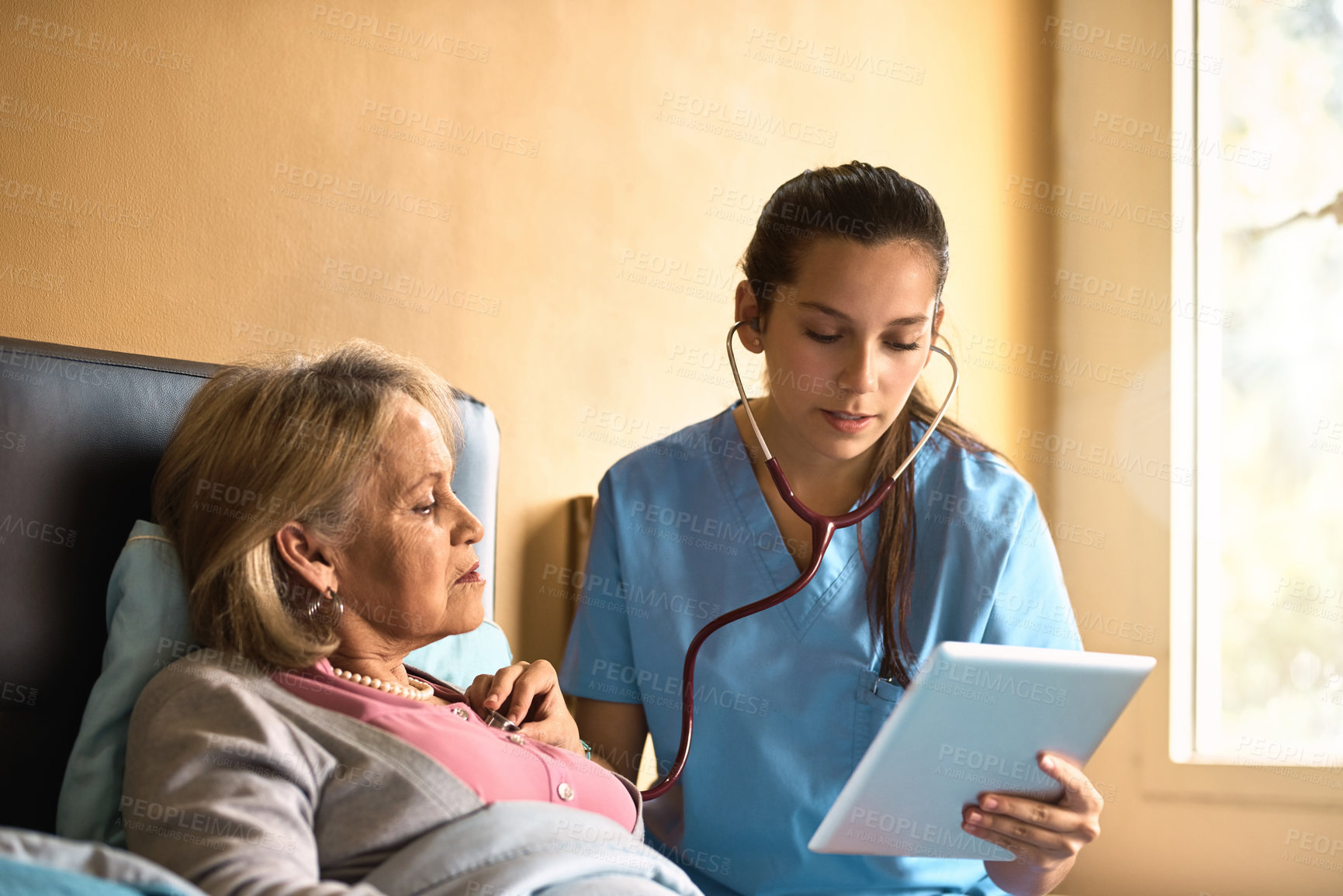 Buy stock photo Tablet, old woman and nurse with stethoscope, healthcare and consultation for heart condition. Caregiver, pensioner and professional with tech, patient info and wellness with digital app for results