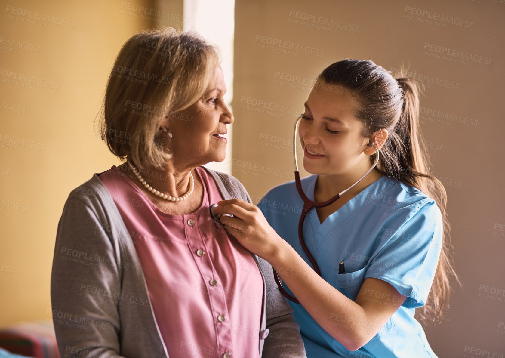 Buy stock photo Senior woman, nurse and stethoscope to listen to heart beat, check up or cardiology exam. Retirement, breathing or doctor test lungs of happy patient for medical healthcare, help or diagnosis in home