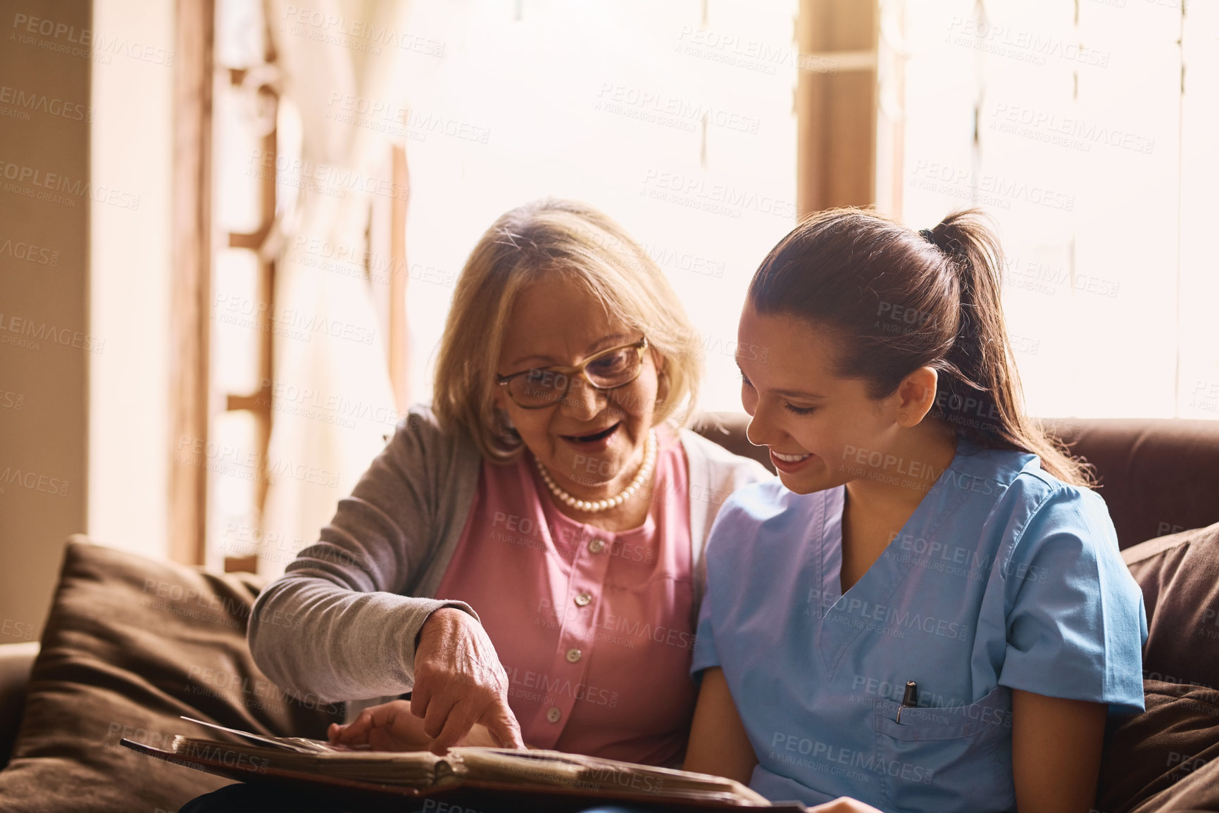 Buy stock photo Healthcare, senior woman and nurse in hospital, photo album and nostalgia of elderly person and history. Retirement, empathy and patience of medical professional, memories and trust with scrapbook 