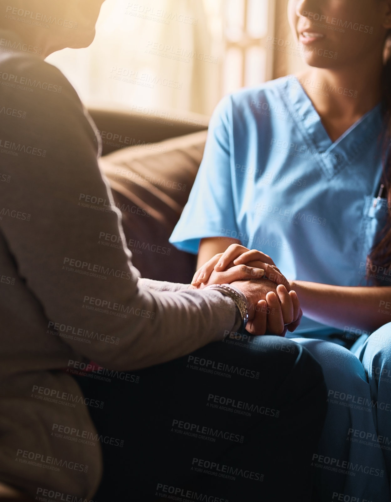 Buy stock photo Cropped shot of a nurse holding a senior woman's hands in comfort