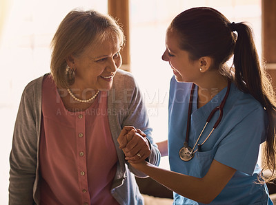 Buy stock photo Nurse, senior woman and holding hands with compassion, comfort or wellness with happiness. Caregiver, pensioner or patient with consultation, home or empathy with trust, kindness or healthcare advice
