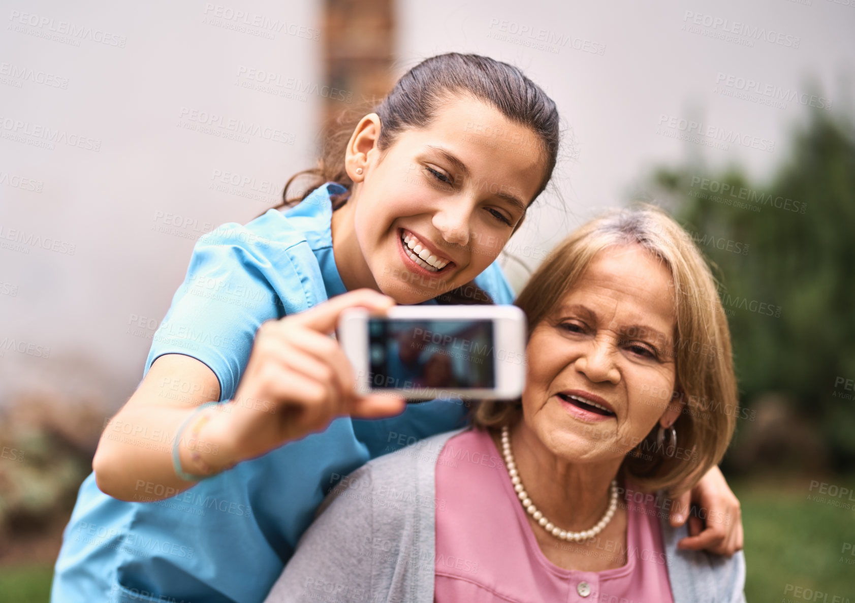 Buy stock photo Selfie, nurse or elderly woman in garden with happiness, comfort or support in senior care. Caregiver, pensioner or smile in nursing home courtyard for photography, screen or trust in assisted living