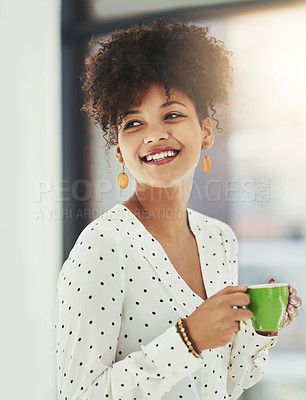 Buy stock photo Cropped shot of a young designer having coffee in her office