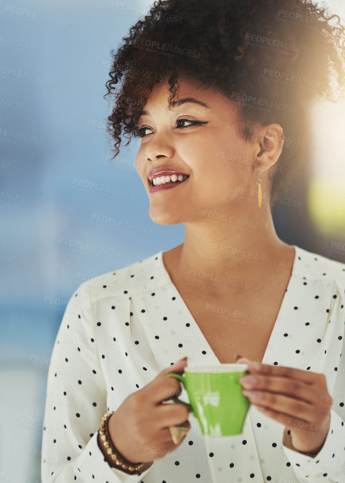 Buy stock photo Cropped shot of a young designer having coffee in her office